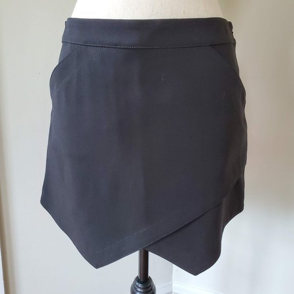 BCBGMaxAzria Dresses & Skirts - BCBG Maxazria black mini skirt triangular hem with pockets size S